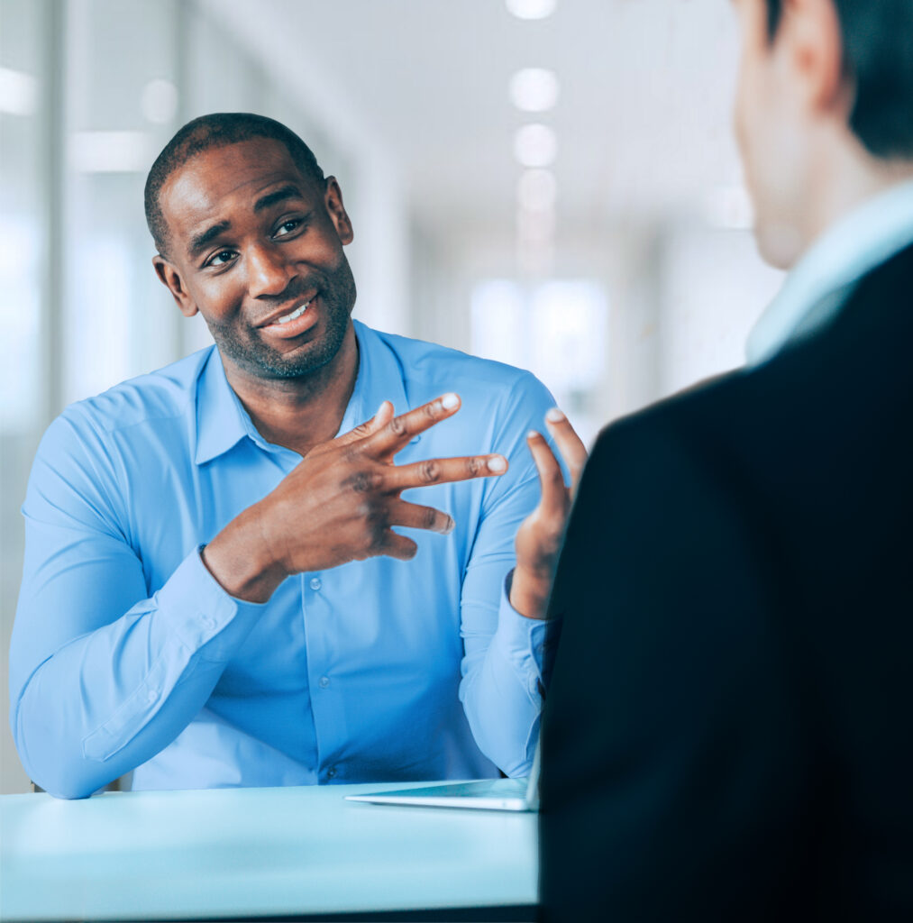 Confident financial advisor talking with client about their planning needs.