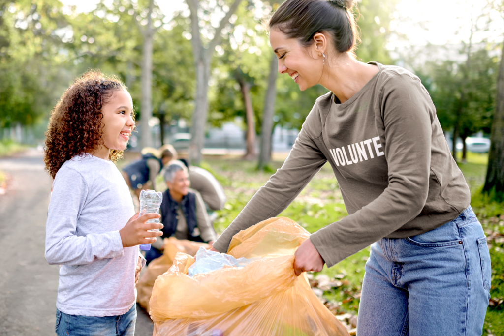 Woman and child volunteering to pick up litter