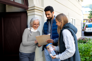 older woman happily donating to a cause or organization